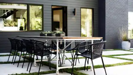 Lochwood-Lozier outdoor patio with industrial table and black chairs in Clyde Hill, WA