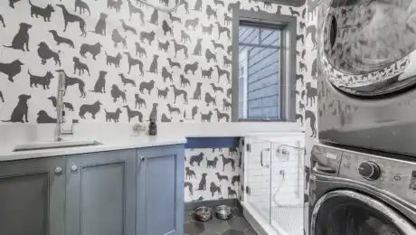 Lochwood-Lozier custom laundry room with dog silhouette wallpaper and honeycomb tile